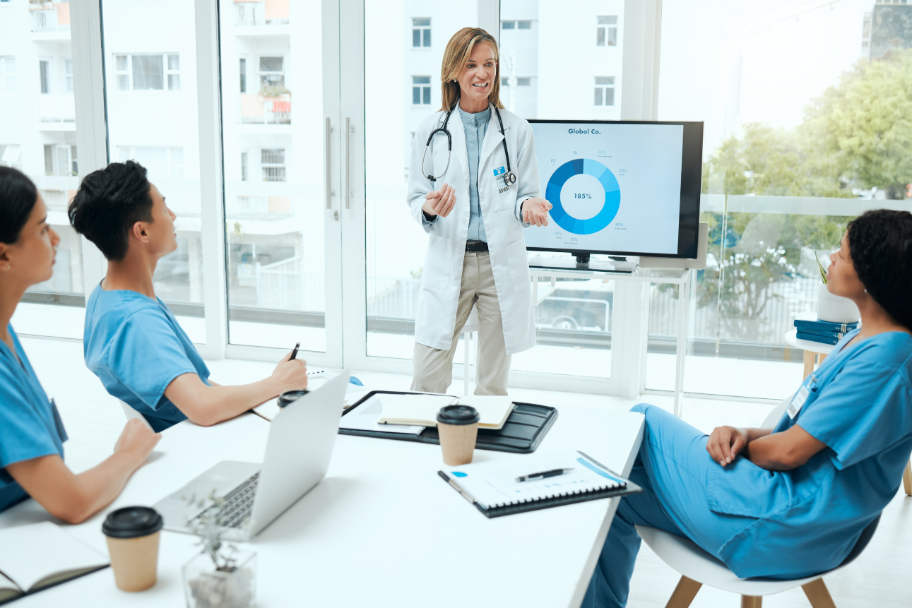 Healthcare worker presenting data to her team
