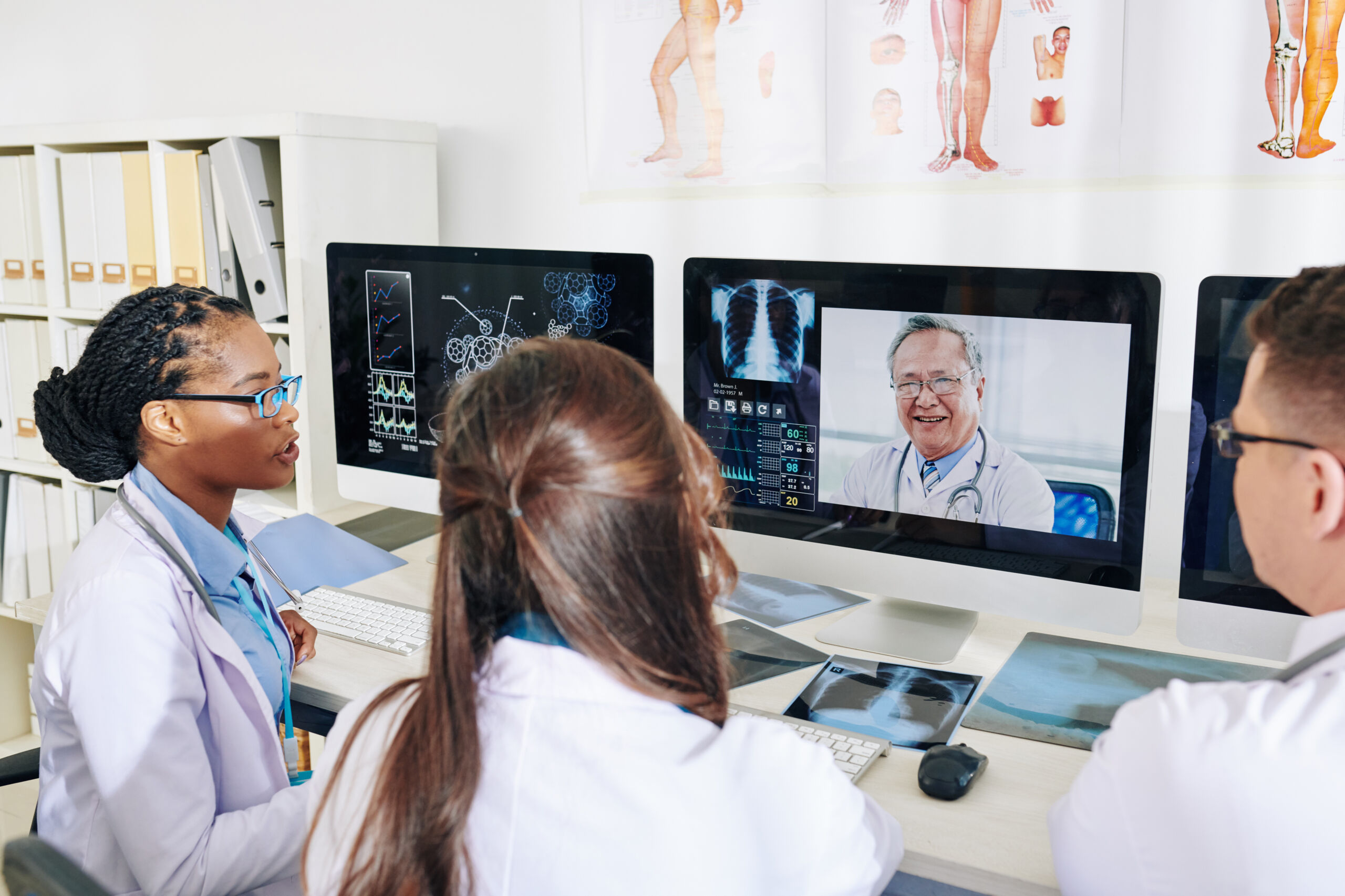 Doctors discussing patient cases during an online meeting for virtual hospitals