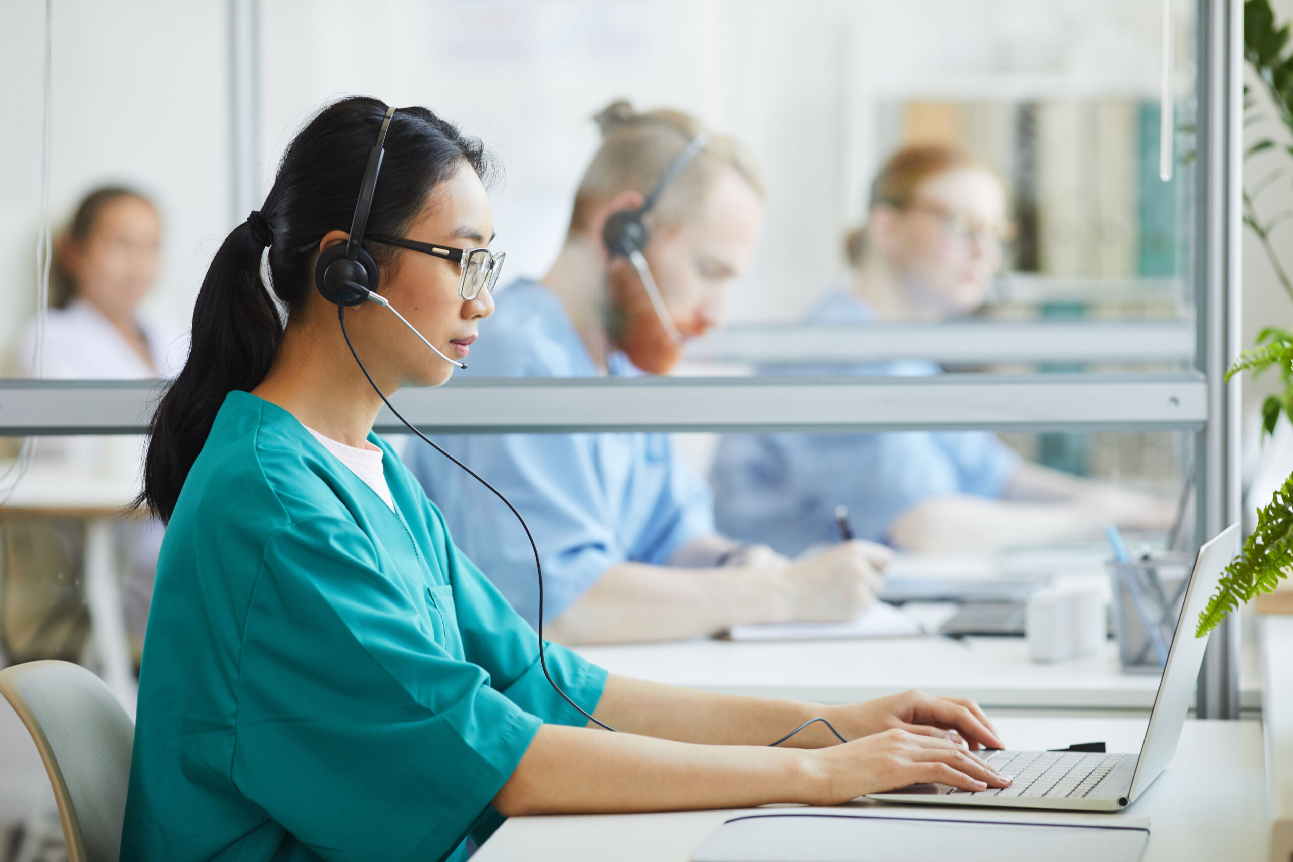 Medical transcription outsourcing team working on patient reports